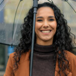 Woman smiling in the rain in Kahului and [test_shortcode]