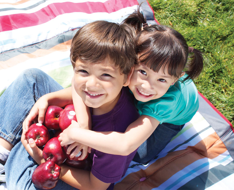 boy and girl with apple