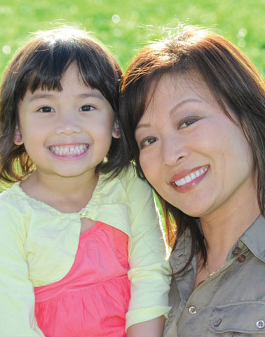 Woman and daughter smiling